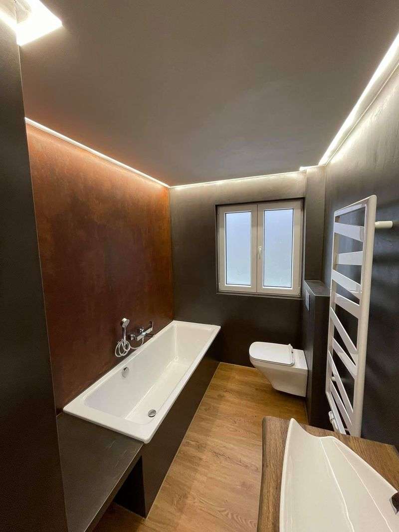 fugenlose-badgestaltung-badsanierung-industrielook-loft-mit-rost-cortenstahl-und-eicheboden-02